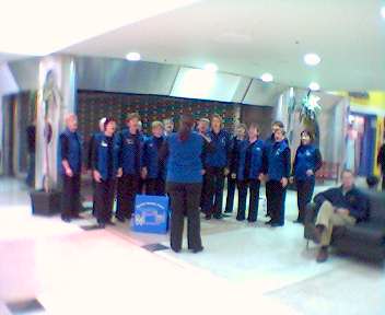 Dunedin Women's choir singing in the Golden Centre mall